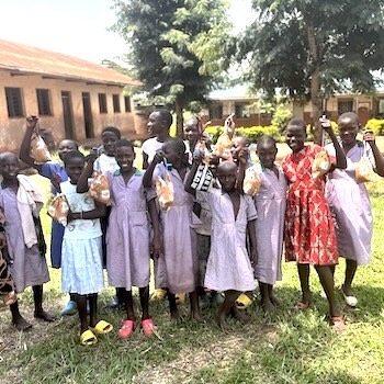 SAG Kit Distribution image showing Naibowa Muslim Primary School girls receiving 86 kits in Kabukye, Uganda on Aug 9, 2024