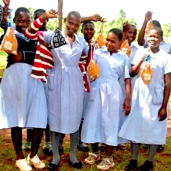 SAG Kit Distribution image showing Busota Primary School girls receiving 192 kits in Busota, Uganda on Aug 13, 2024