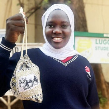 SAG Kit Distribution image showing Lugoba High School girls receiving 93 kits in Kyebando, Uganda on Sep 27, 2024