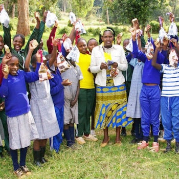 SAG Kit Distribution image showing Mwenji Primary School girls receiving 143 kits in Ihururu, Kenya on Oct 3, 2024