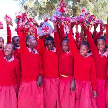 SAG Kit Distribution image showing Oloipiri Primary School girls receiving 48 kits in Loliondo, Tanzania on Oct 9, 2024