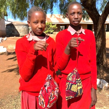 SAG Kit Distribution image showing Oloipiri Primary School girls receiving 48 kits in Loliondo, Tanzania on Oct 9, 2024