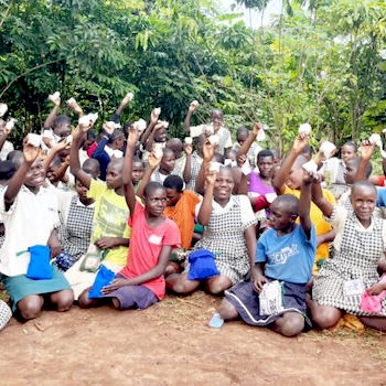 SAG Kit Distribution image showing Compassion Primary School girls receiving 178 kits in Busota, Uganda on Oct 16, 2024