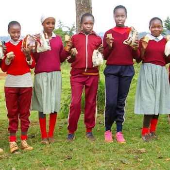 SAG Kit Distribution image showing Kahigaini Primary School girls receiving 127 kits in Kahigaini, Kenya on Oct 17, 2024