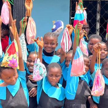 SAG Kit Distribution image showing Joy Bilingual School girls receiving 92 kits in Kumba, Cameroon on Oct 23, 2024