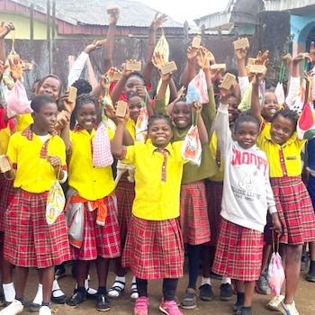 SAG Kit Distribution image showing Oxford International School girls receiving 86 kits in Bamenda, Cameroon on Oct 23, 2024