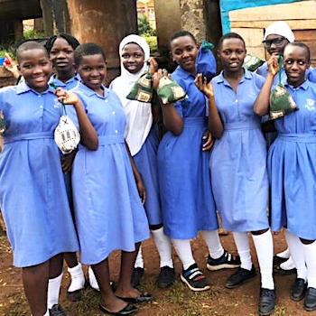 SAG Kit Distribution image showing Lubiri Primary School girls receiving 100 kits in Rubaga, Uganda on Nov 1, 2024