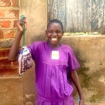 SAG Kit Distribution image showing Nkono Primary School girls receiving 72 kits in Ivukula, Uganda on Nov 15, 2024
