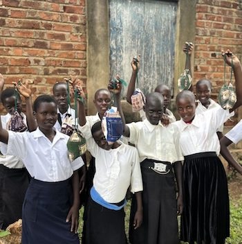 SAG Kit Distribution image showing Nkono Memorial Secondary School girls receiving 197 kits in Ivukula, Uganda on Nov 15, 2024