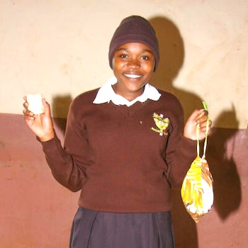 SAG Kit Distribution image showing St. Benedict Wamutitu School girls receiving 135 kits in Mukurweini, Kenya on Nov 15, 2024