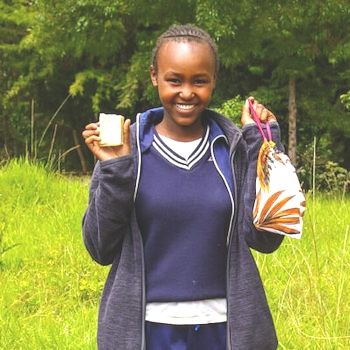 SAG Kit Distribution image showing Huhoini Primary School girls receiving 145 kits in Huhoini, Kenya on Jan 30, 2025