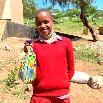 SAG Kit Distribution image showing Oloipiri Primary School girls receiving 30 kits in Loliondo, Tanzania on Feb 12, 2025