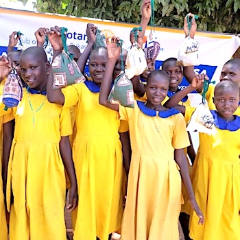 SAG Kit Distribution image showing Kapasak Primary School girls receiving 400 kits in Ongino, Uganda on Feb 13, 2025