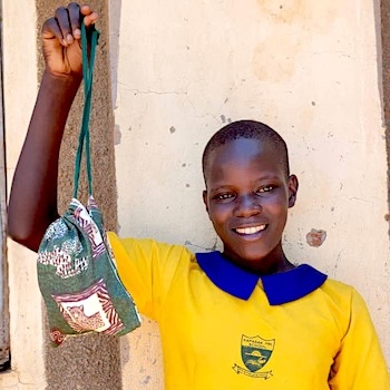 SAG Kit Distribution image showing Kapasak Primary School girls receiving 400 kits in Ongino, Uganda on Feb 13, 2025