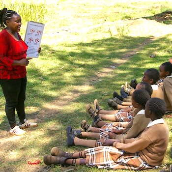 SAG Kit Distribution image showing Kiguru Primary School girls receiving 238 kits in Mweiga, Kenya on Feb 14, 2025