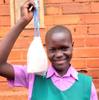 SAG Kit Distribution image showing Bualasa COU Primary School girls receiving 197 kits in Wobulenzi, Uganda on Mar 28, 2025