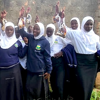 SAG Kit Distribution image showing Bombo Secondary School girls receiving 383 kits in Bombo, Uganda on Apr 15, 2025