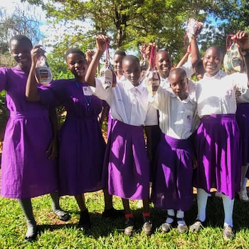 SAG Kit Distribution image showing Buziika Primary School girls receiving 351 kits in Buziika, Uganda on Apr 22, 2025