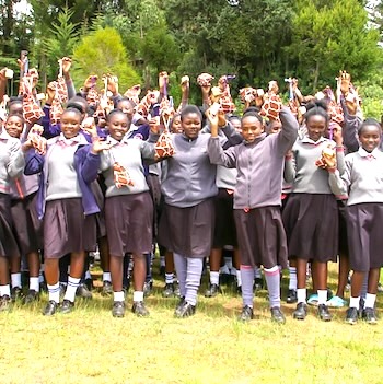 SAG Kit Distribution image showing Kimuri Secondary girls receiving 143 kits in Kimuri, Kenya on May 8, 2025