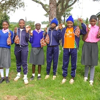 SAG Kit Distribution image showing Mugunda Primary School girls receiving 195 kits in Nairutia, Kenya on May 8, 2025