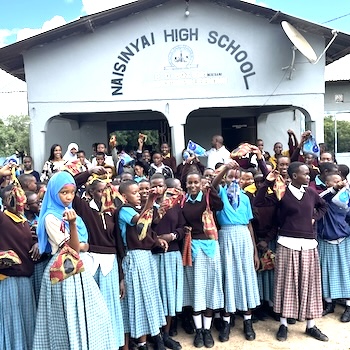 SAG Kit Distribution image showing Naisinyai High School girls receiving 209 kits in Simanjiro, Tanzania on May 14, 2025
