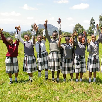 SAG Kit Distribution image showing Ngooru Secondary School girls receiving 211 kits in Tetu, Kenya on May 30, 2025