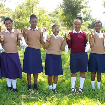 SAG Kit Distribution image showing Kanjora Secondary School girls receiving 79 kits in Tetu, Kenya on May 30, 2025