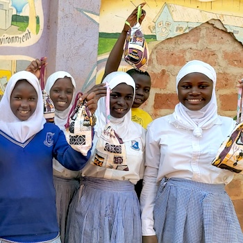 SAG Kit Distribution image showing Kalule Umea Primary School girls receiving 163 kits in Kalule, Uganda on Jul 3, 2025