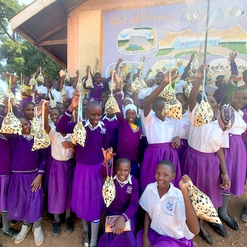 SAG Kit Distribution image showing Kalule C/U Primary School girls receiving 335 kits in Kalule, Uganda on Jul 31, 2025
