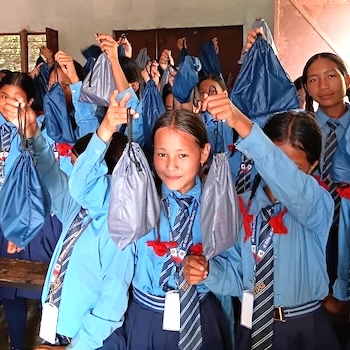 SAG Kit Distribution image showing Shree Dipendra Secondary School girls receiving 60 kits in Rolpa Municipality-1, Nepal on Sep 8, 2025
