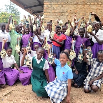 SAG Kit Distribution image showing Lady Irene Primary School girls receiving 102 kits in Iganga, Uganda on Sep 25, 2025