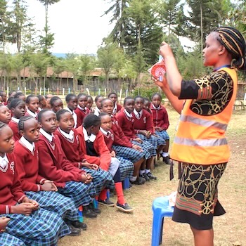 SAG Kit Distribution image showing Kimahuri Primary girls receiving 387 kits in Kimahuri, Kenya on Sep 26, 2025