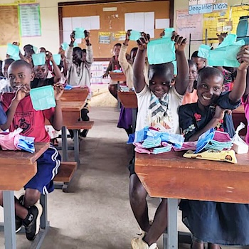 SAG Kit Distribution image showing St. Theresa Girls Primary School girls receiving 77 kits in Luwero, Uganda on Oct 16, 2025