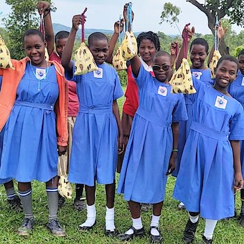 SAG Kit Distribution image showing St. Theresa Nandere Primary School girls receiving 210 kits in Luwero, Uganda on Oct 16, 2025