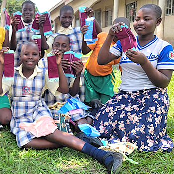 SAG Kit Distribution image showing St. Catherine Junior School girls receiving 15 kits in Wobulenzi, Uganda on Oct 28, 2025