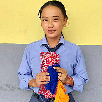 SAG Kit Distribution image showing Dang Valley School girls receiving 150 kits in Ghorahi, Nepal on Nov 12, 2025