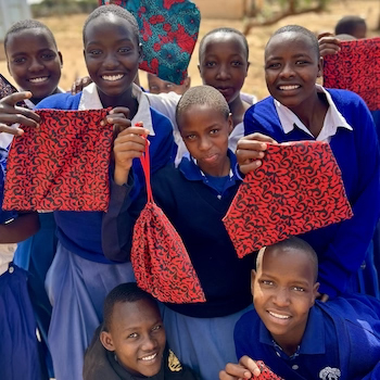 SAG Kit Distribution image showing Emboreet Primary School girls receiving 100 kits in Simanjiro, Tanzania on Dec 4, 2025