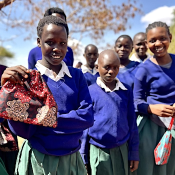 SAG Kit Distribution image showing Kaangala Primary School girls receiving 100 kits in Simanjiro, Tanzania on Dec 5, 2025