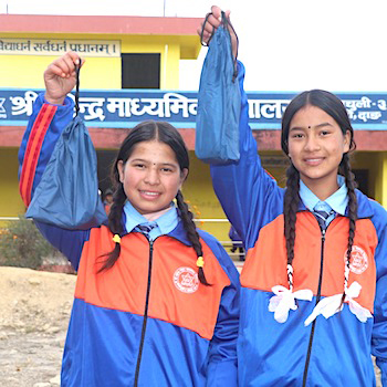 SAG Kit Distribution image showing Mahendra Secondary School girls receiving 150 kits in Sriwari, Nepal on Dec 22, 2025