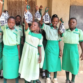 SAG Kit Distribution image showing Bukusu Primary School girls receiving 166 kits in Lukomera, Uganda on Mar 4, 2025