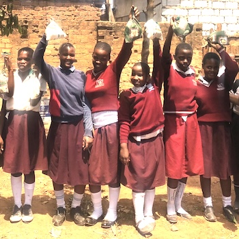 SAG Kit Distribution image showing Katwe Martyrs Primary School girls receiving 105 kits in Katwe, Uganda on Feb 20, 2025