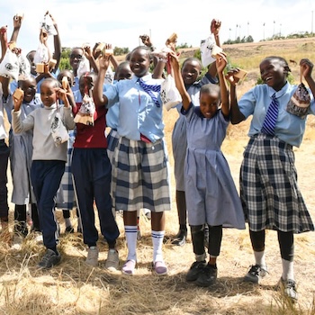 SAG Kit Distribution image showing Kiaragana Primary School girls receiving 125 kits in Kiawara, Kenya on Mar 7, 2025