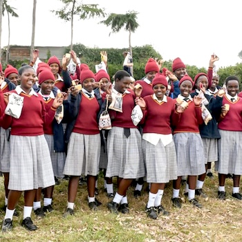 SAG Kit Distribution image showing Observation Hill Secondary School girls receiving 122 kits in Watuka, Kenya on Mar 7, 2025