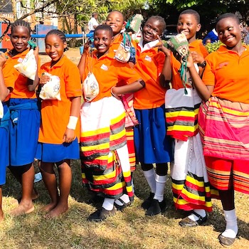 SAG Kit Distribution image showing St. Paul Primary School girls receiving 68 kits in Nsambya, Uganda on Feb 28, 2025