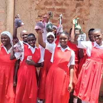 SAG Kit Distribution image showing Wobulenzi UMEA girls receiving 146 kits in Wobulenzi, Uganda on Mar 11, 2025