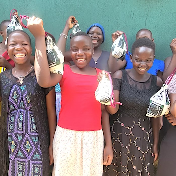 SAG Kit Distribution image showing Kayandu Village Girls girls receiving 100 kits in Kayandu, Uganda on Jan 20, 2026