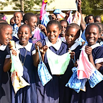 SAG Kit Distribution image showing Sweetwaters Primary School girls receiving 175 kits in Sweetwaters, Kenya on Jan 27, 2026