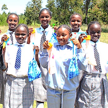SAG Kit Distribution image showing Gitonga Primary School girls receiving 153 kits in Kamburaini, Kenya on Feb 5, 2026