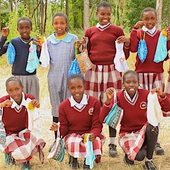 SAG Kit Distribution image showing Irura Primary School girls receiving 150 kits in Sweetwater, Kenya on Feb 12, 2026