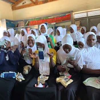 SAG Kit Distribution image showing Nakaloke Secondary School girls receiving 263 kits in Mbale, Uganda on Feb 17, 2026